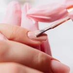 manicurist-paints-fingernails
