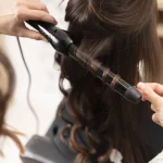 woman-getting-treatment-hairdresser-shop